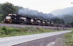 Classic power pulling an empty coal train